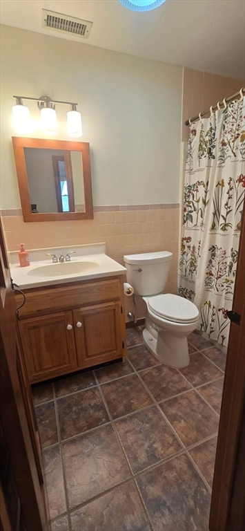 9 Birch Hill Road West Brookfield, MA 01585 - Photo 30 of 38 a bathroom with a toilet and a shower curtain