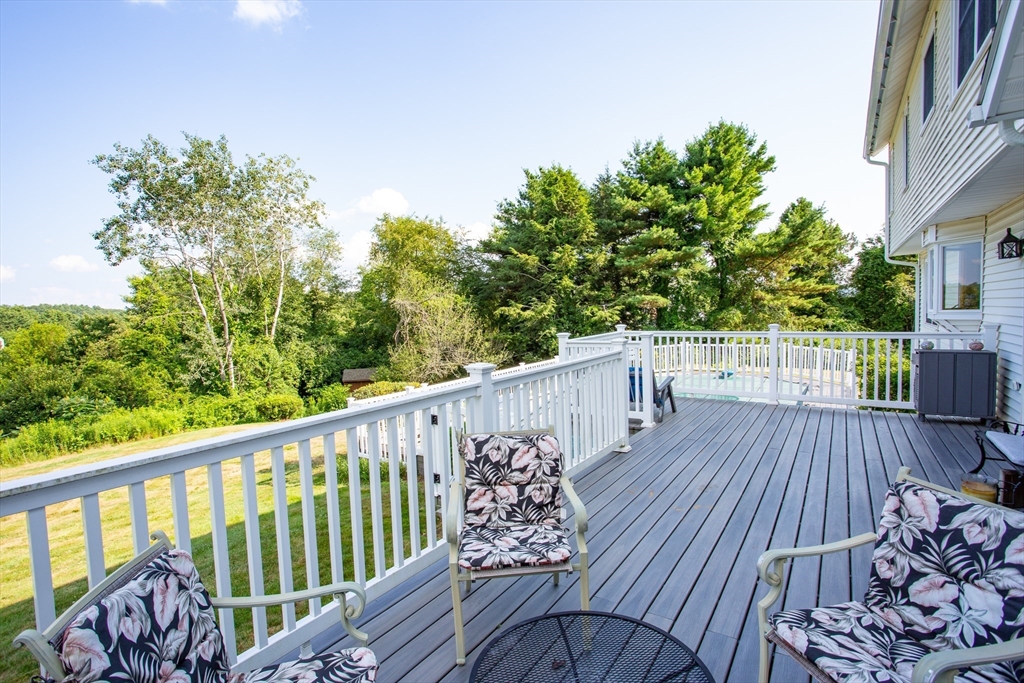 9 Birch Hill Road West Brookfield, MA 01585 - Photo 3 of 38 a view of balcony with wooden floor and fence