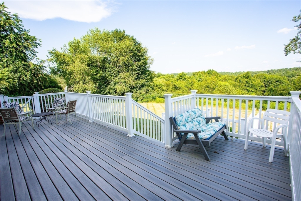 9 Birch Hill Road West Brookfield, MA 01585 - Photo 32 of 38 a view of a deck with furniture and wooden floor