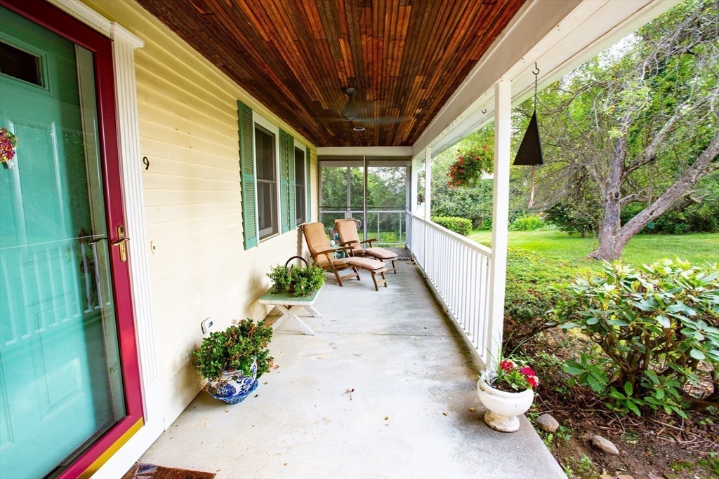 9 Birch Hill Road West Brookfield, MA 01585 - Photo 34 of 38 a porch with chairs and potted plants