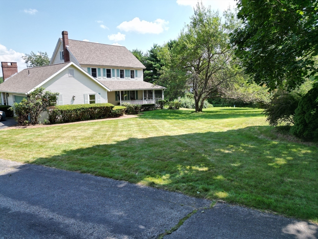 9 Birch Hill Road West Brookfield, MA 01585 - Photo 37 of 38 a view of a house with big yard and large trees