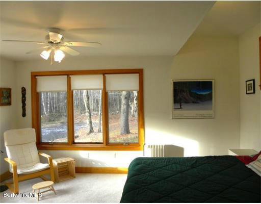 264 A Patten Road Shelburne Falls, MA 01370 - Photo 17 of 25 a living room with a large bed furniture and a large window