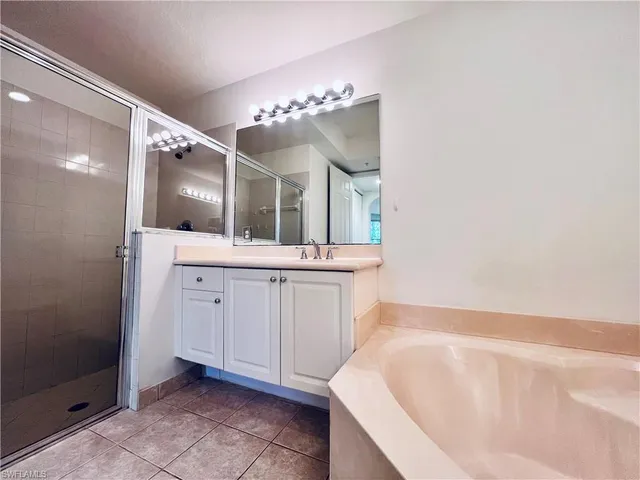 an empty room with a ceiling fan and window