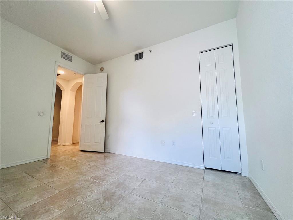 1435 Mariposa Circle, Unit 102 Naples, FL 34105 - Photo 14 of 24 a view of an empty room
