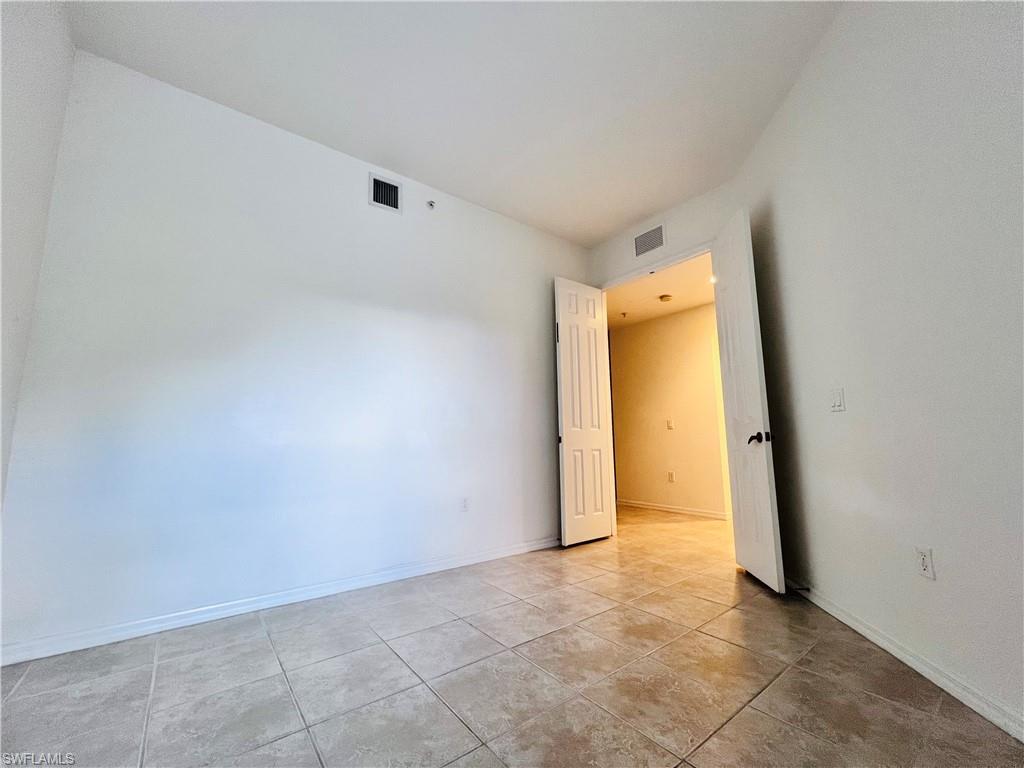 1435 Mariposa Circle, Unit 102 Naples, FL 34105 - Photo 17 of 24 a view of an empty room