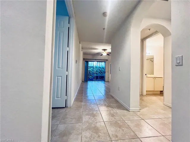 a kitchen with cabinets and window