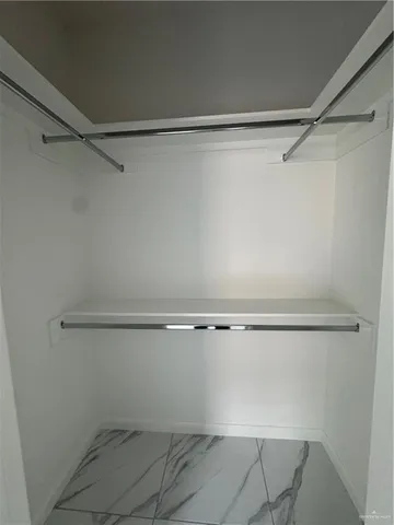 a view of a room with racks on the wall