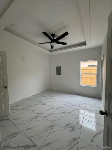 a view of an empty room with a window