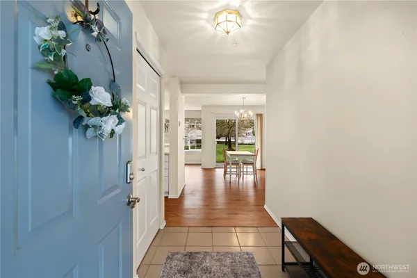 a view of a hallway and dining room