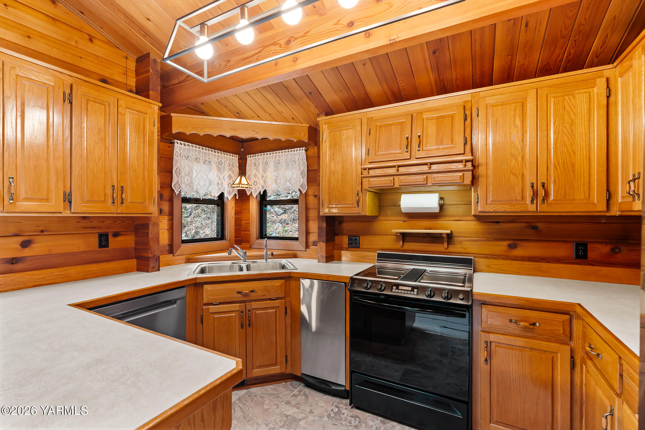 120 Eagles Ridge Lane Naches, WA 98937 - Photo 14 of 31 a kitchen with stainless steel appliances a stove a sink and a microwave