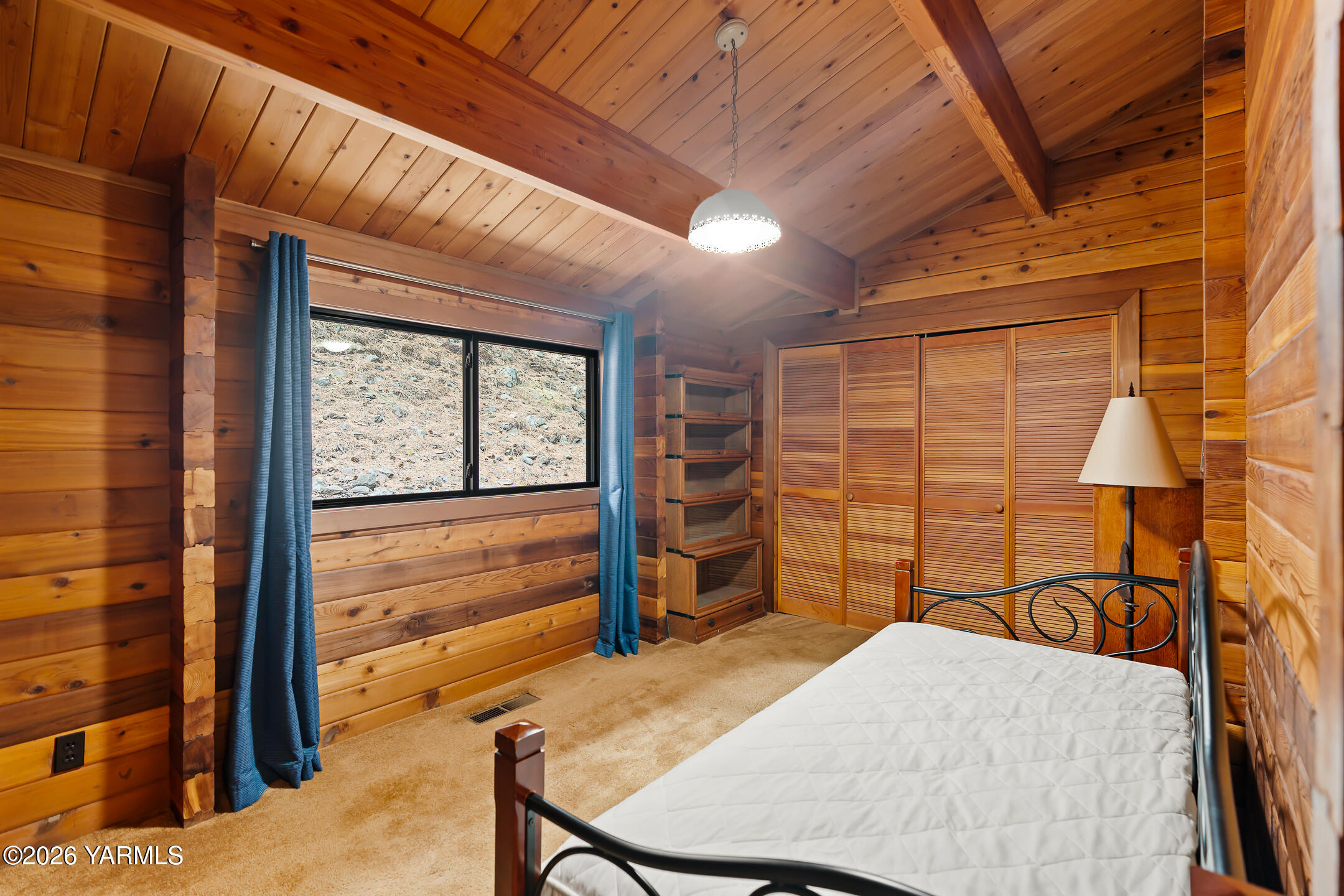 120 Eagles Ridge Lane Naches, WA 98937 - Photo 24 of 31 a bedroom with a bed a table and chair
