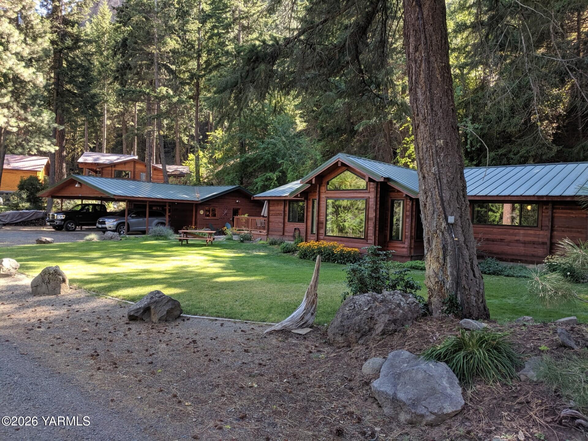 120 Eagles Ridge Lane Naches, WA 98937 - Photo 30 of 31 a front view of a house with garden and trees