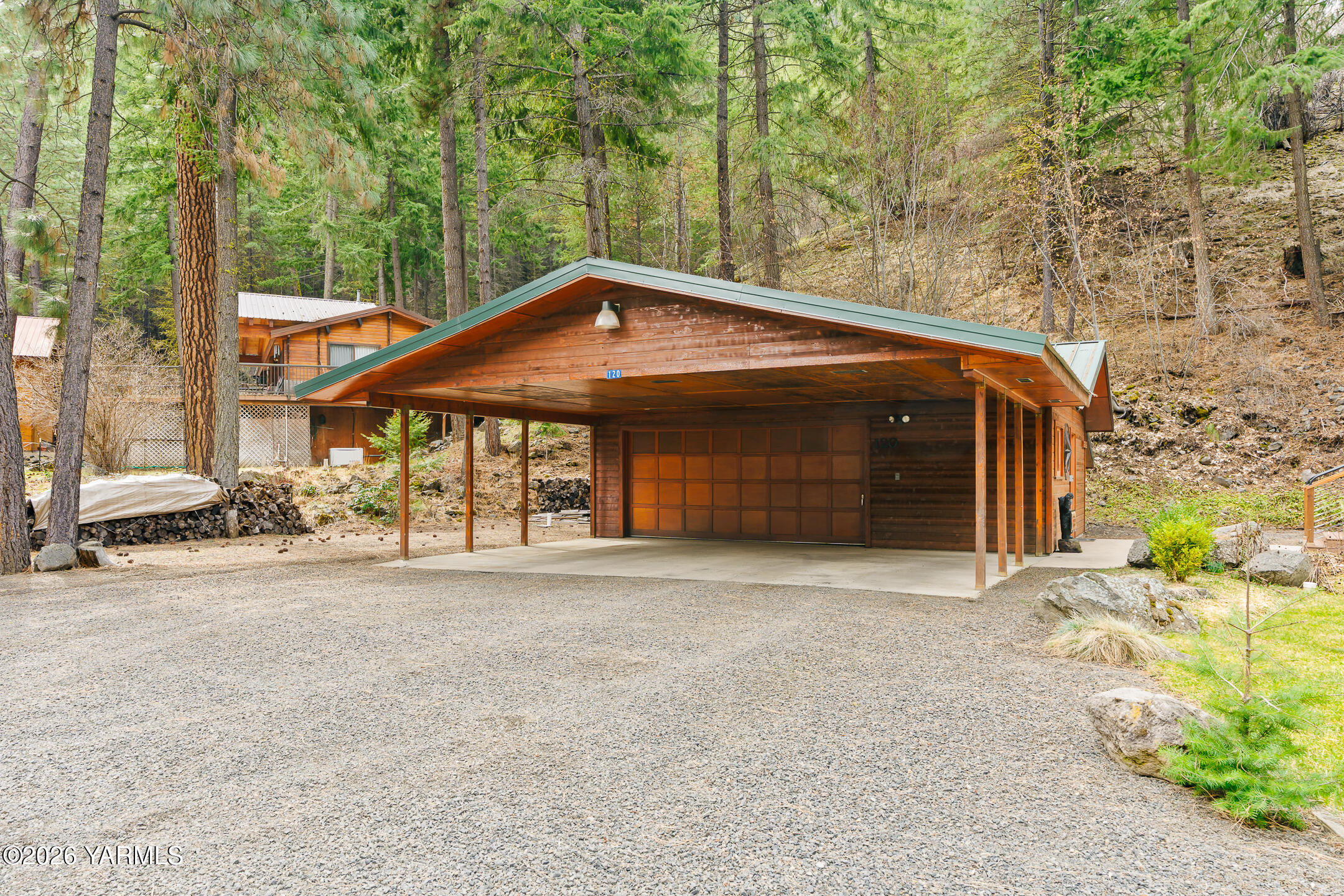 120 Eagles Ridge Lane Naches, WA 98937 - Photo 3 of 31 a front view of a house with a garden