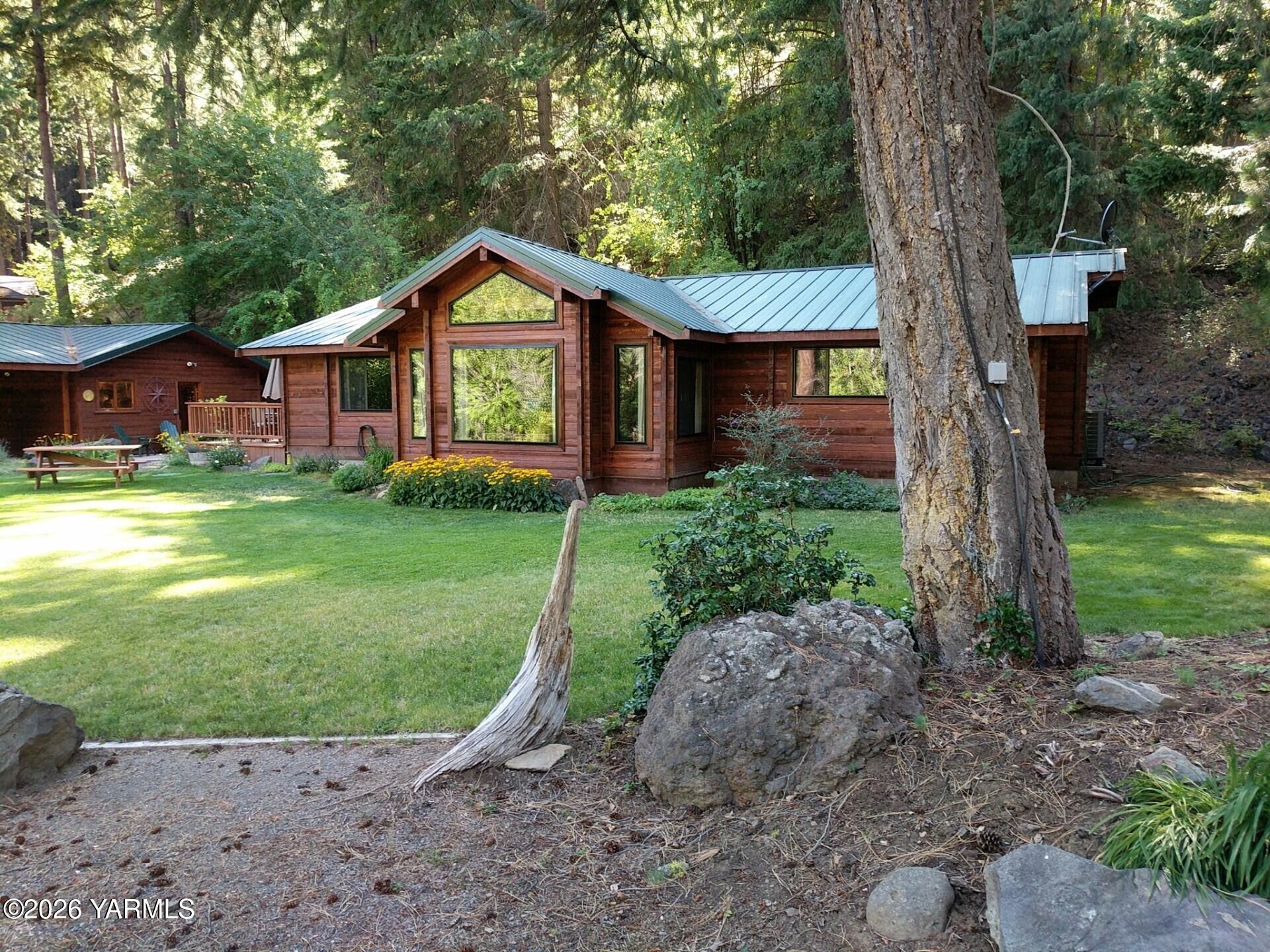 120 Eagles Ridge Lane Naches, WA 98937 - Photo 31 of 31 a view of a house with a yard