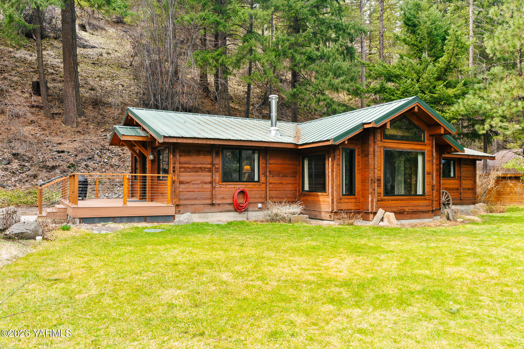 120 Eagles Ridge Lane Naches, WA 98937 - Photo 4 of 31 a view of a house with a backyard patio and swimming pool