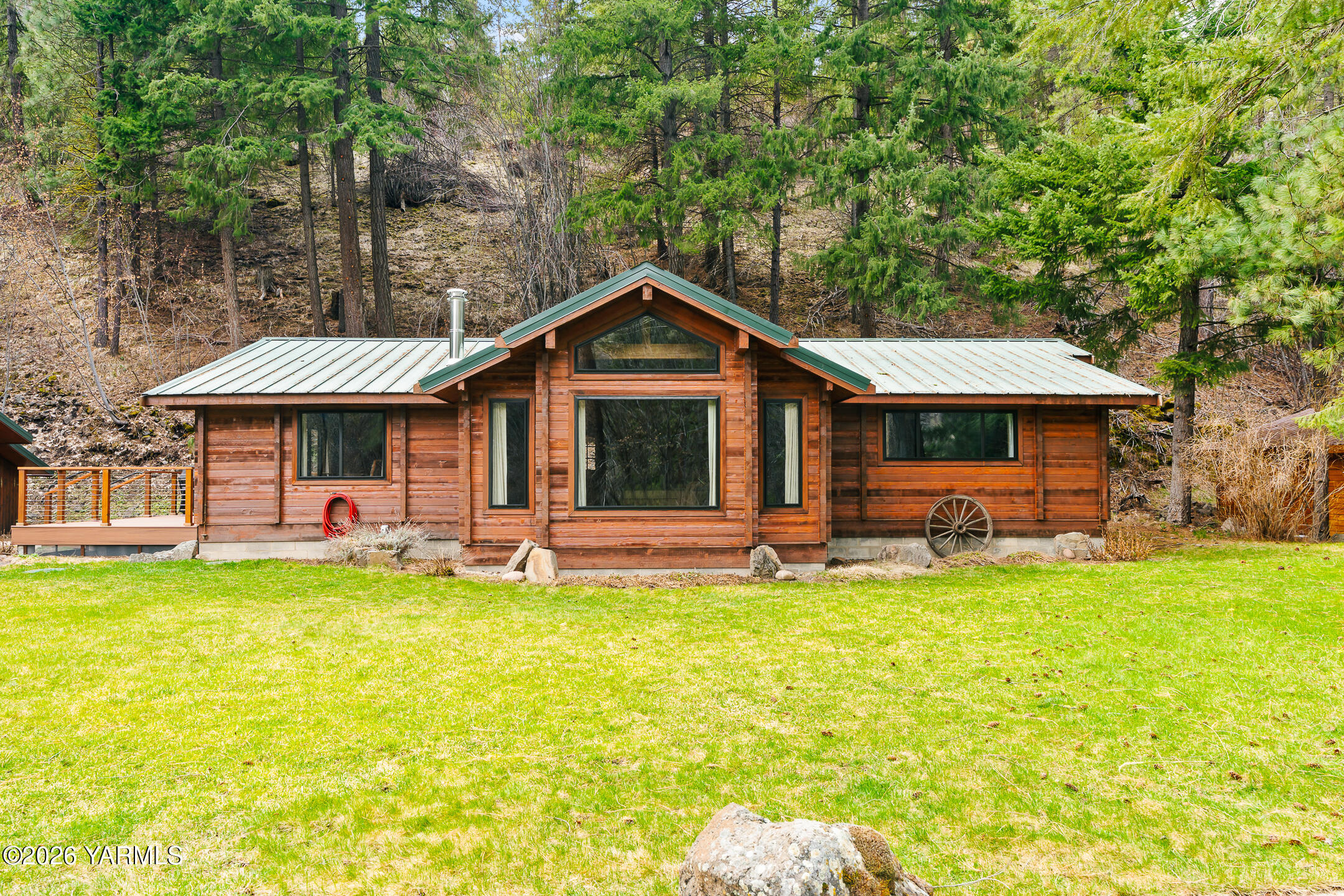 120 Eagles Ridge Lane Naches, WA 98937 - Photo 5 of 31 a front view of a house with a garden and swimming pool