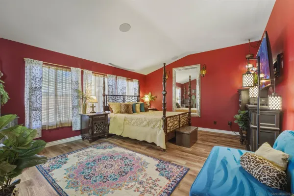 a bed room with a bed and a tv