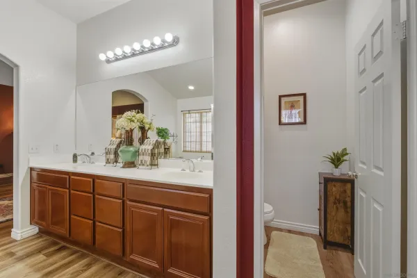 a view of walk in closet with clothes