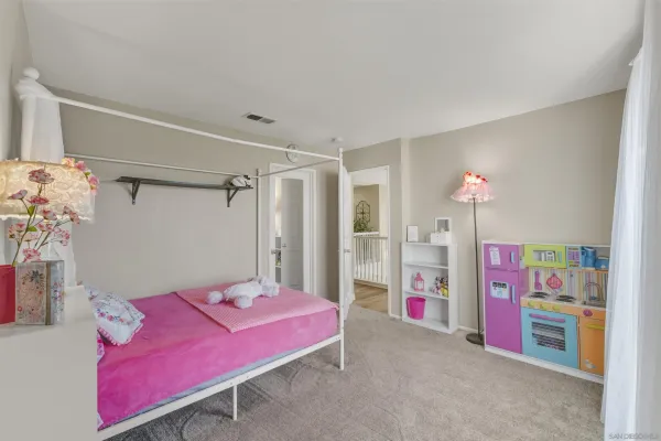 an empty room with window and closet