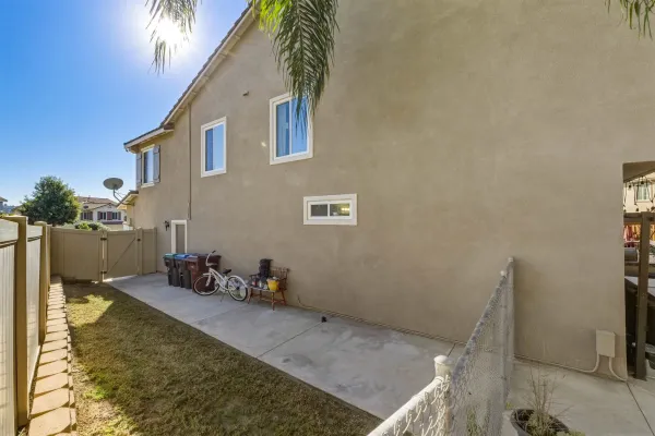 an aerial view of a house with garden space and street view