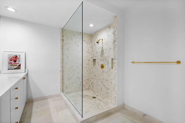 a bathroom with a shower and a sink
