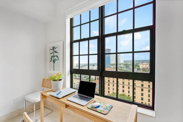 a laptop computer sitting on top of a desk