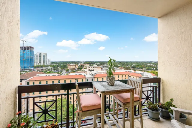 a view of a chairs and table in patio