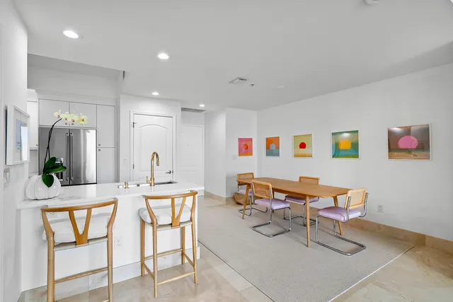 a dining room with a table and chairs