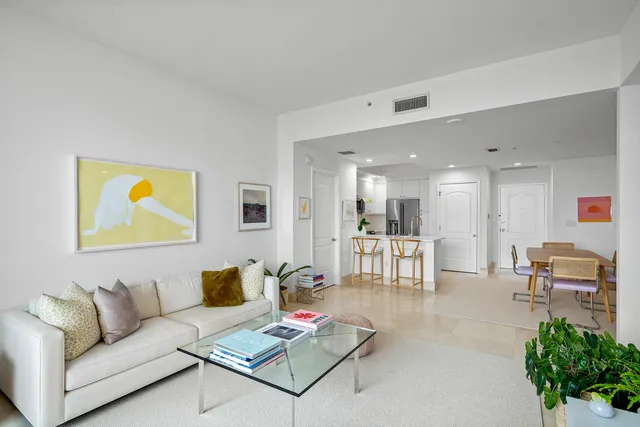 a living room with furniture and a table