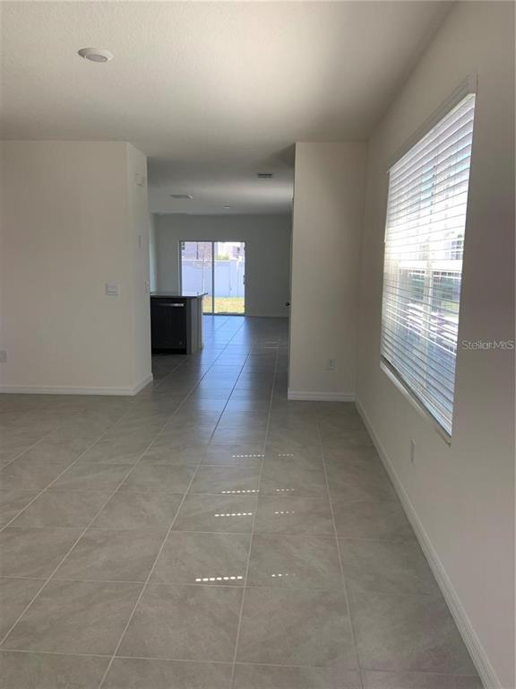5518 Oxford Gray Road Wesley Chapel, FL 33545 - Photo 3 of 11 a view of a livingroom with a window