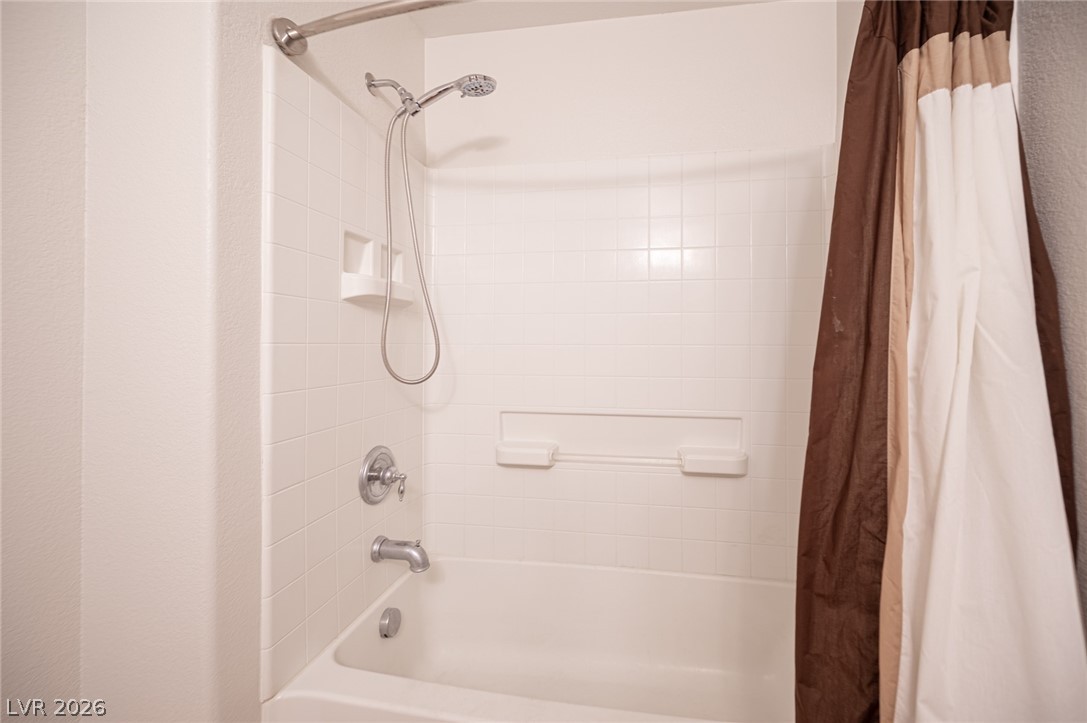 7701 West Robindale Road, Unit 274 Las Vegas, NV 89113 - Photo 24 of 38 This bathroom features a functional shower and tub combination, perfect for daily routines.