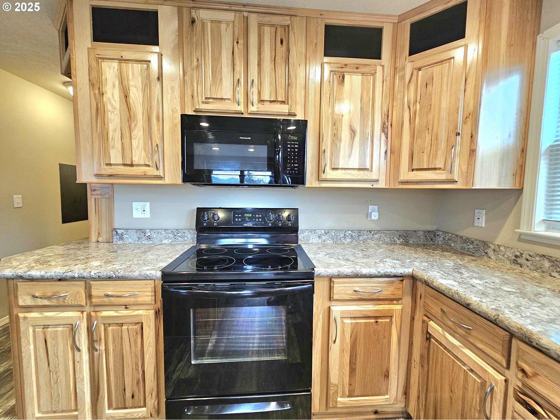 4675 Union Terrace Springfield, OR 97478 - Photo 12 of 37 a kitchen with granite countertop a sink stove and cabinets
