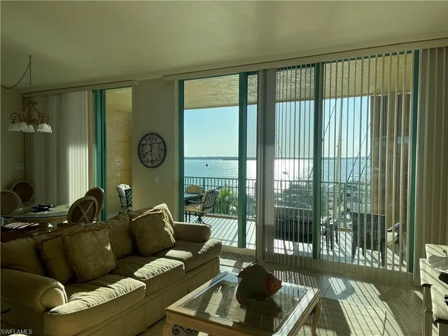 a bed room with a bed and a chandelier