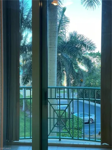 a bedroom with bed and a chandelier