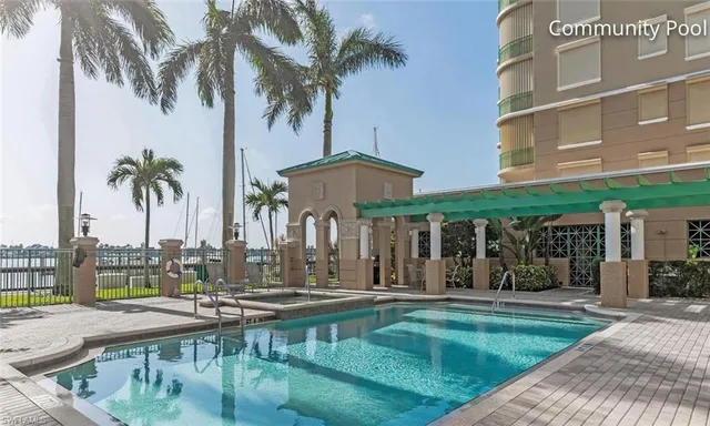 a view of a house with swimming pool and porch with furniture