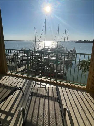 a view of balcony with wooden floor