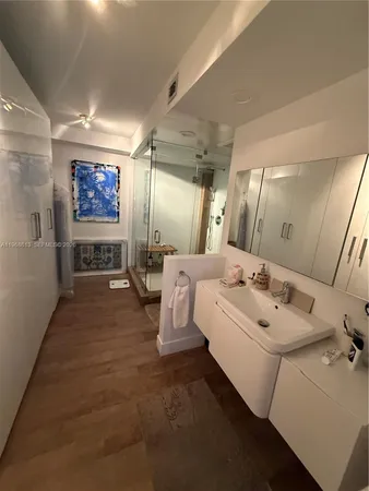 a spacious bathroom with a double vanity sink and a mirror
