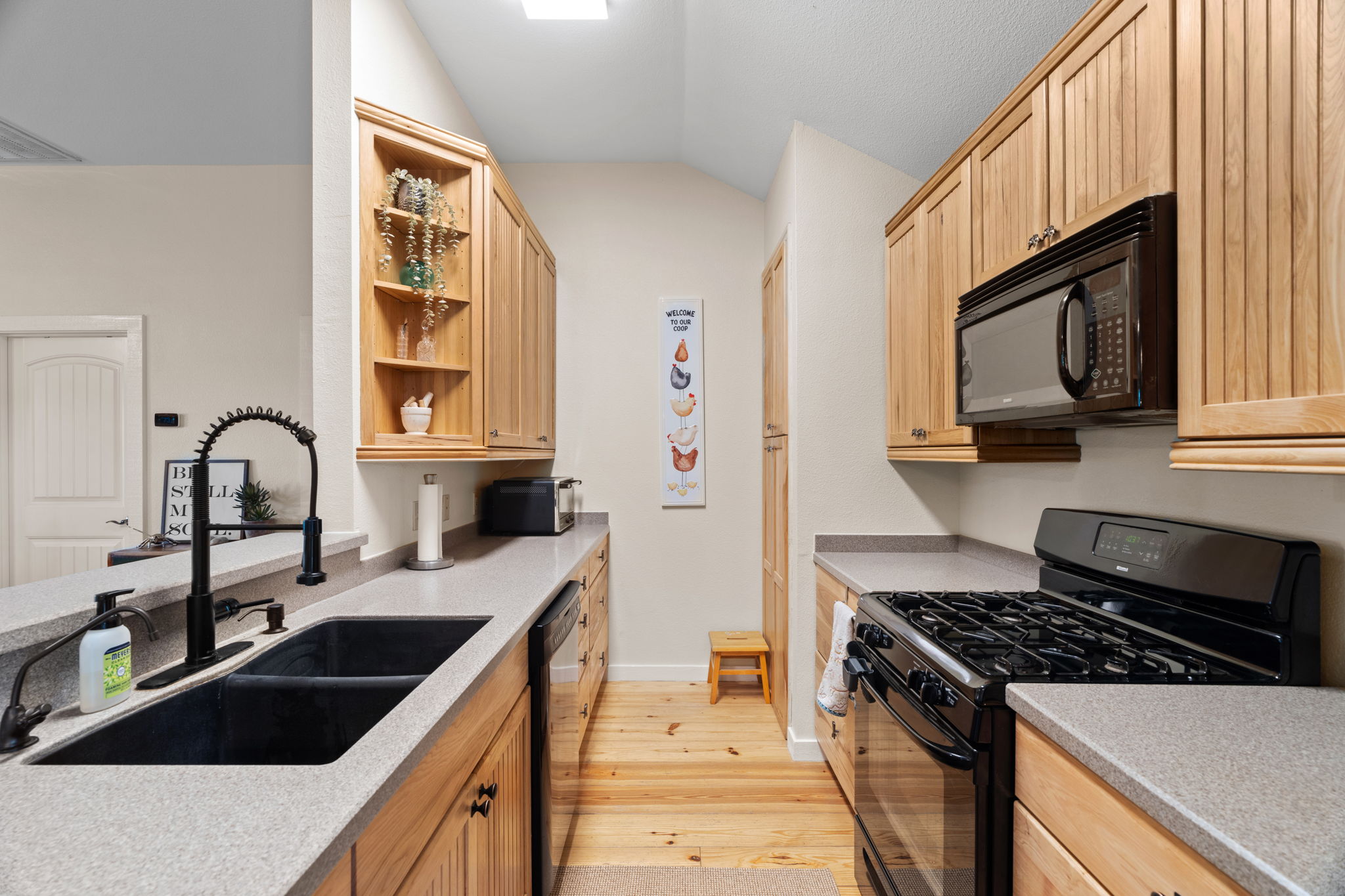 3434 Prairie-Lea Road Kingsbury, TX 78638 - Photo 8 of 38 a kitchen with granite countertop a sink stove and cabinets