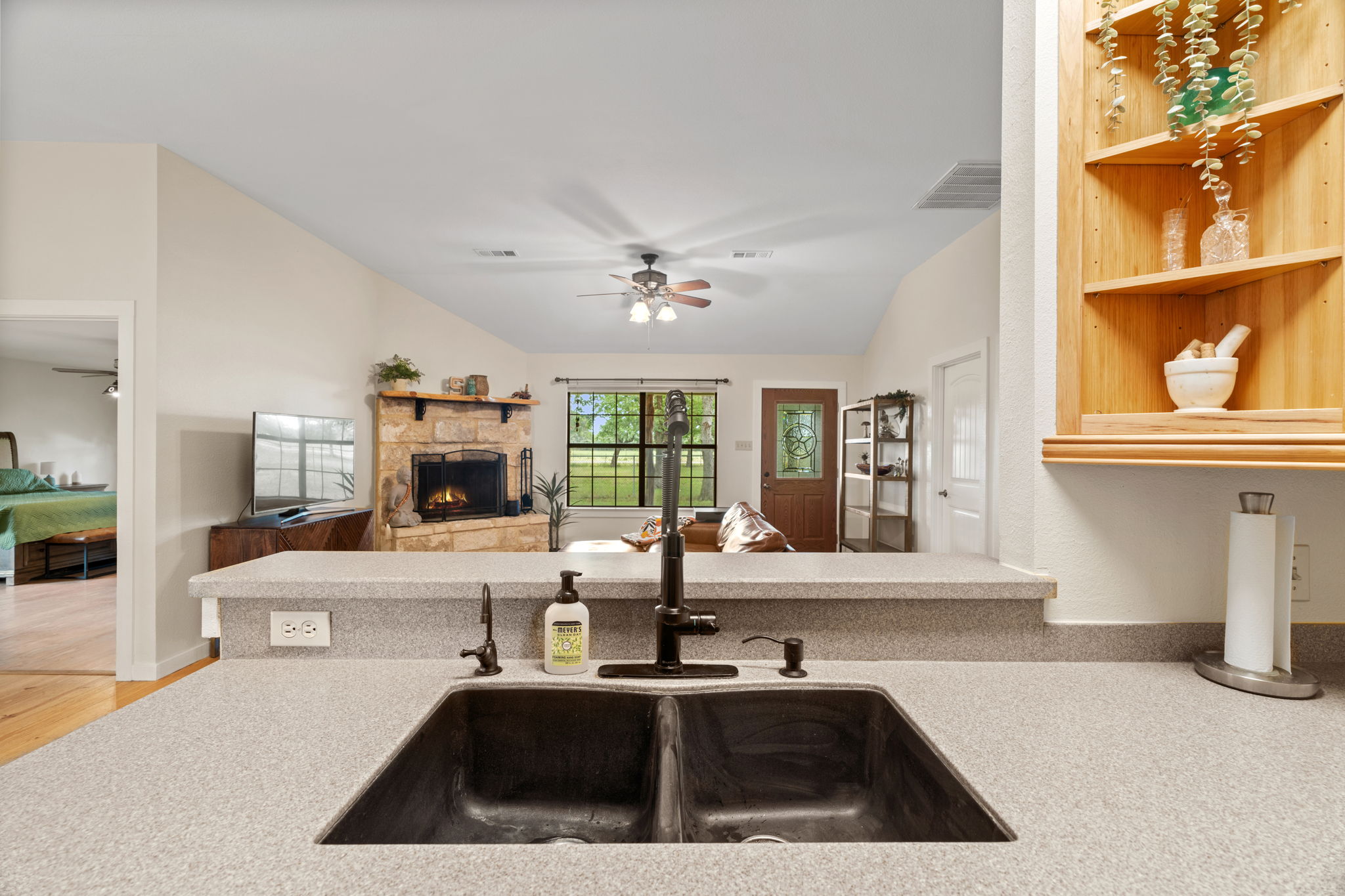 3434 Prairie-Lea Road Kingsbury, TX 78638 - Photo 38 of 38 a kitchen with a sink and a stove top oven
