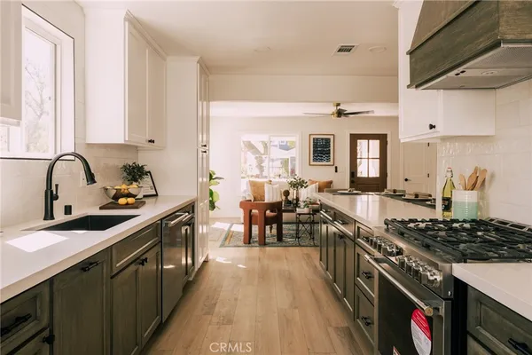 a kitchen with lots of counter top space and stove