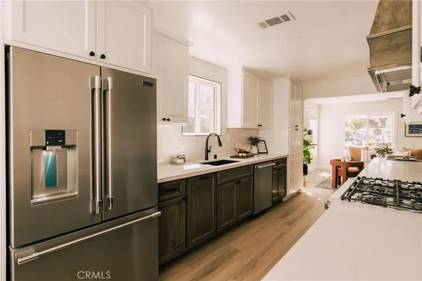 a large kitchen with a large window