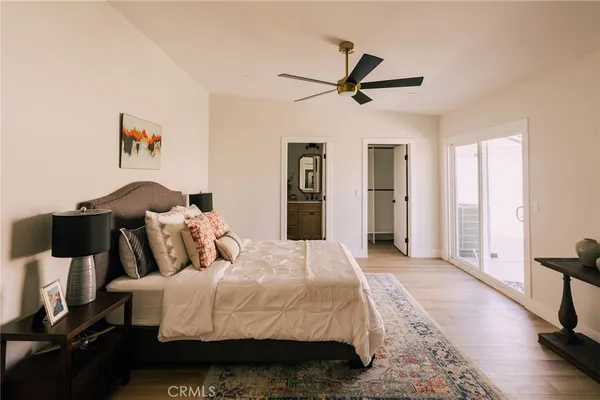 a bed room with a bed and a chair
