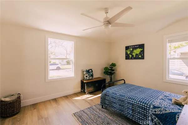 a bedroom with bed and window