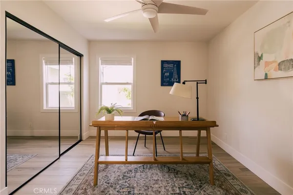 a workspace with furniture and window