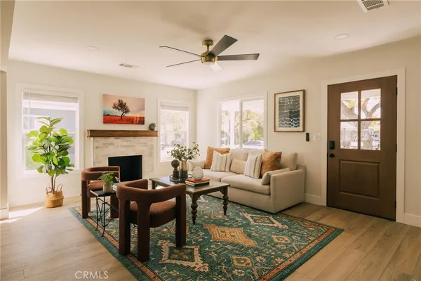 a living room with furniture a window and a fireplace