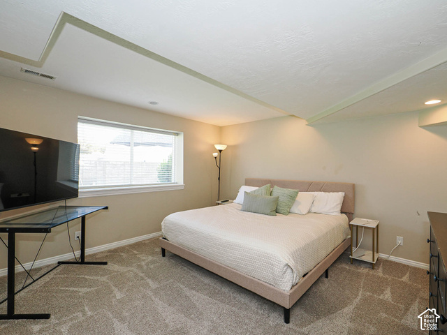 11779 South Stone Ridge Court Ridge West Riverton, UT 84065 - Photo 64 of 85 Recessed lighting, window with blinds, tray ceiling, and neutral-toned wall paint