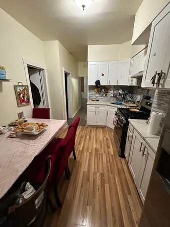 a kitchen with a sink appliances and cabinets