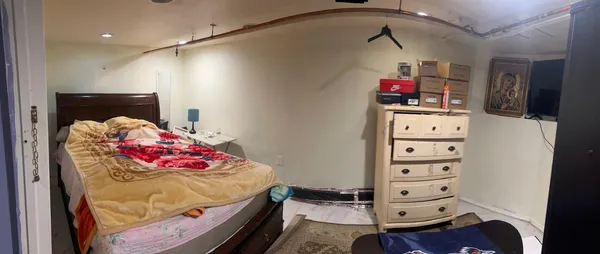 a bedroom with a bed and a closet