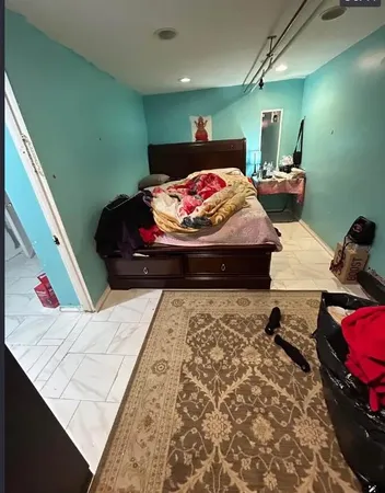 a bed room with a bed and a couch