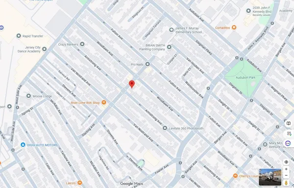 a white bed sitting in a bathtub next to a white building